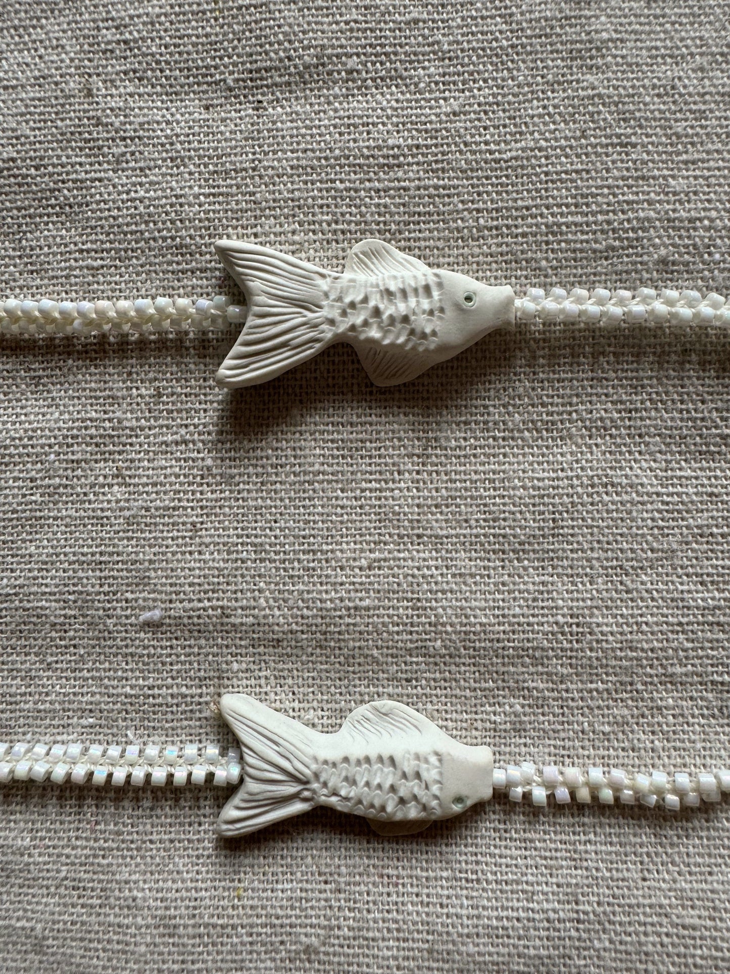 C.River fish necklace, symbiosis